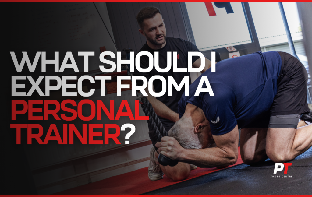 personal trainer coaching client during structured gym session